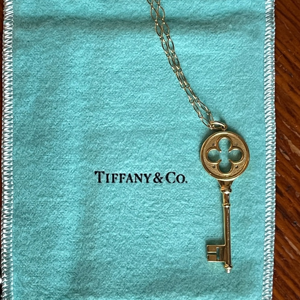 Retired Tiffany Quatrefoil Gold and Diamond key necklace 18kt